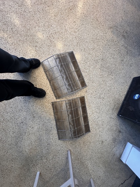 Dusty AC filters removed for cleaning