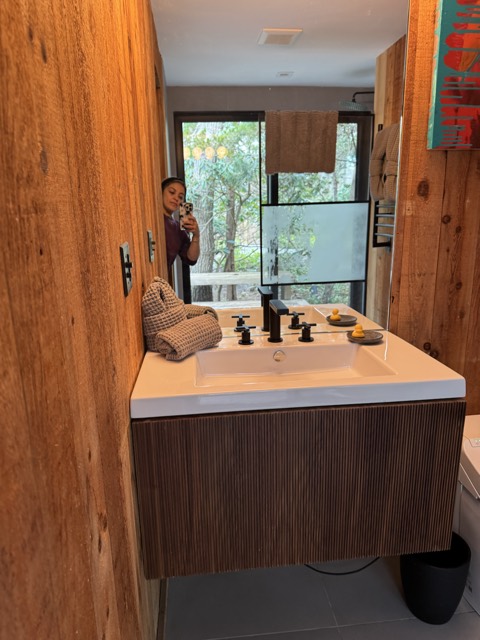 Bathroom vanity, sink and mirror wiped down
