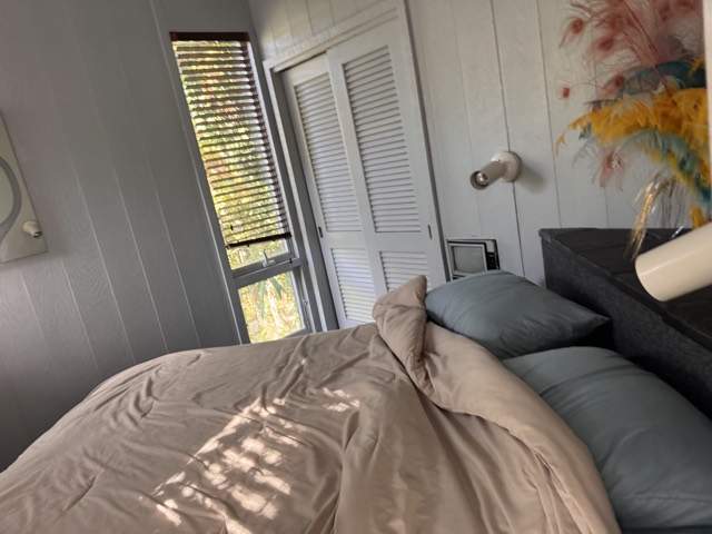 Bedroom with bedding refreshed and window light