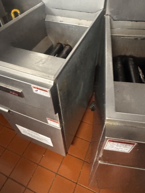 Commercial fryers pulled out for deep cleaning