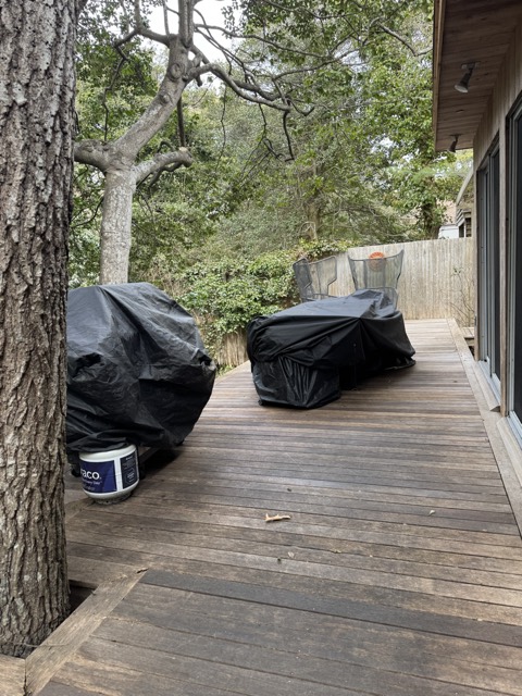 Deck with covered grills, swept and tidied