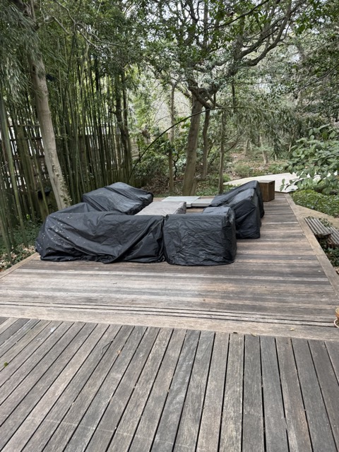 Deck with outdoor furniture covered and cleaned