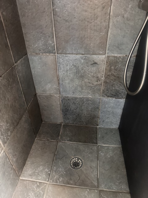 Slate tile shower scrubbed clean